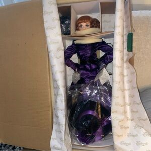 Elegant Purple and Black Porcelain Doll